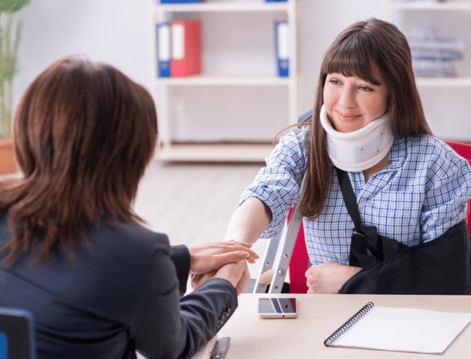 An injured person speaking to a lawyer